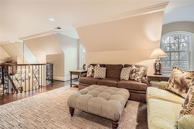 living room with dark hardwood / wood-style flooring, vaulted ceiling, and crown molding