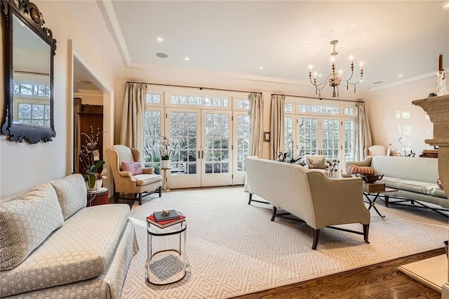 interior space with hardwood / wood-style flooring, an inviting chandelier, and french doors