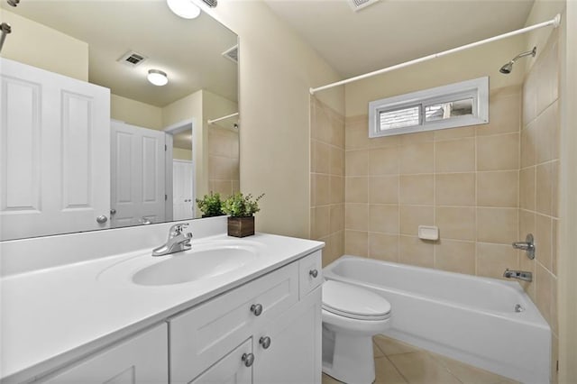 bathroom featuring visible vents, shower / bathing tub combination, toilet, vanity, and tile patterned flooring