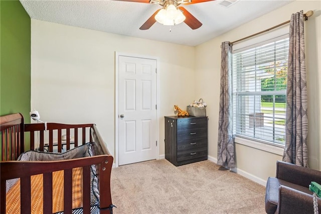 1671 Bismarck Cir, Winder, GA 30680 - bedroom featuring light colored carpet, baseboards, and ceiling fan