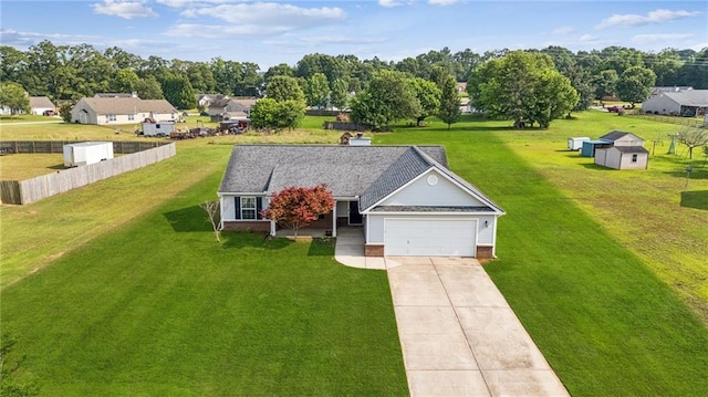 1671 Bismarck Cir, Winder, GA 30680 - view of front facade with driveway, an attached garage, and a storage unit