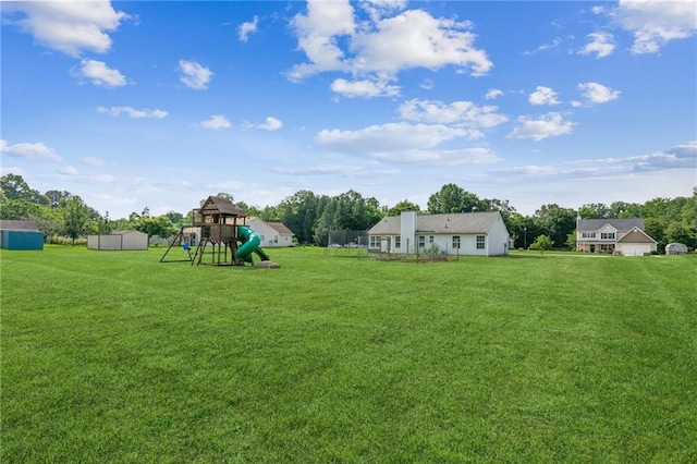 1671 Bismarck Cir, Winder, GA 30680 - view of green lawn with a playground