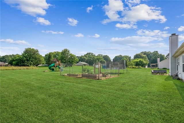 1671 Bismarck Cir, Winder, GA 30680 - view of grassy yard featuring a playground and a garden