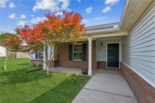1671 Bismarck Cir, Winder, GA 30680 - property entrance featuring brick siding, covered porch, and a shingled roof