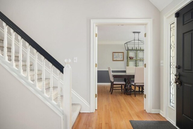 2689 Spring Rock Ct NE, Roswell, GA 30075 - entryway with stairs, light wood-type flooring, and a chandelier