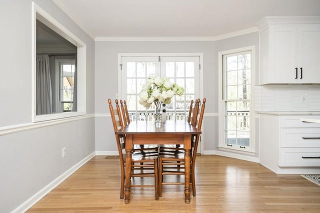 2689 Spring Rock Ct NE, Roswell, GA 30075 - dining space featuring light wood finished floors and ornamental molding