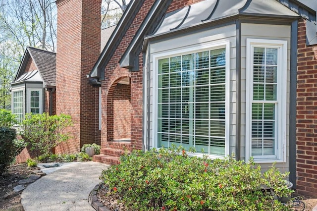 2689 Spring Rock Ct NE, Roswell, GA 30075 - property entrance with a chimney and brick siding