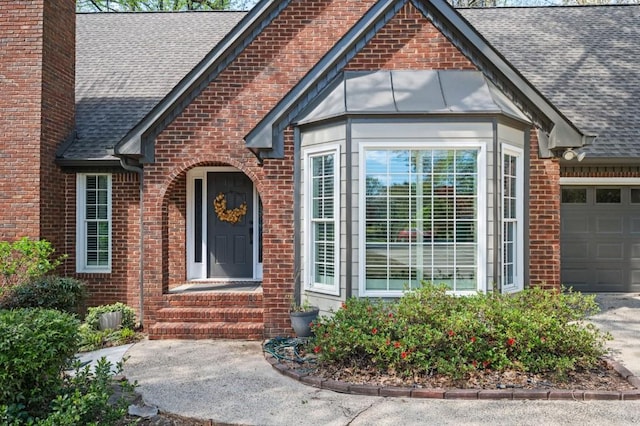 2689 Spring Rock Ct NE, Roswell, GA 30075 - entrance to property featuring a shingled roof, brick siding, a chimney, and a garage