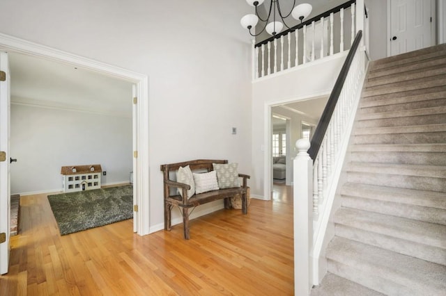 2689 Spring Rock Ct NE, Roswell, GA 30075 - stairs featuring wood finished floors and a chandelier
