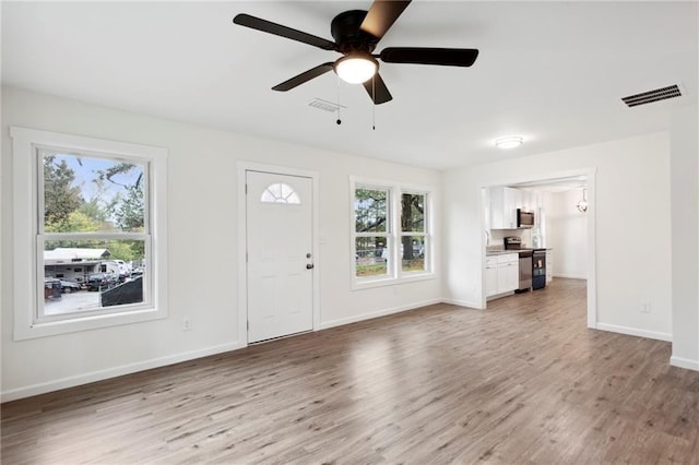 329 Cranfill Rd SE, Marietta, GA 30060 - foyer featuring plenty of natural light, light wood-style flooring, and baseboards