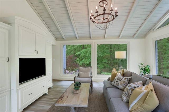 living room with an inviting chandelier, dark hardwood / wood-style flooring, and vaulted ceiling with beams