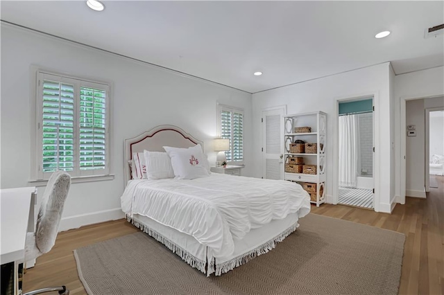 bedroom with light hardwood / wood-style flooring