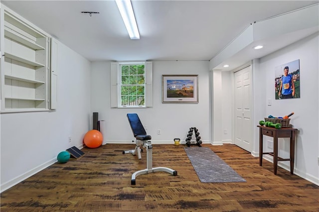 workout area featuring dark hardwood / wood-style floors