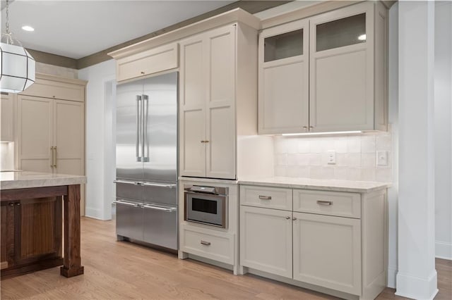 384 Hickory Pass, Alpharetta, GA 30004 - kitchen with appliances with stainless steel finishes, light wood-style flooring, light stone counters, decorative backsplash, and recessed lighting