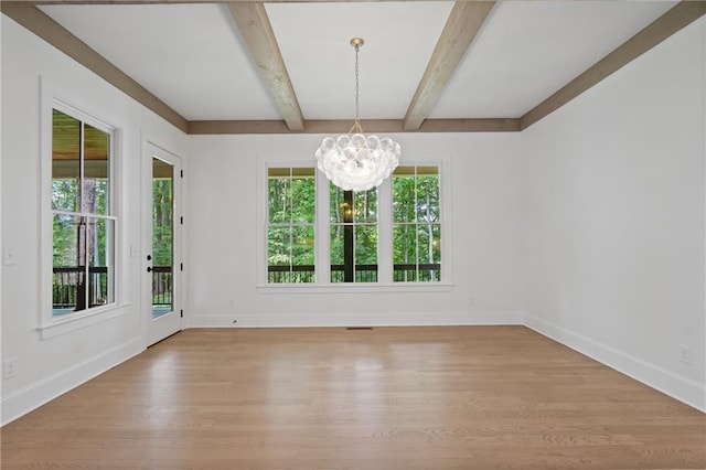 384 Hickory Pass, Alpharetta, GA 30004 - unfurnished dining area featuring a chandelier, light wood finished floors, beamed ceiling, and baseboards