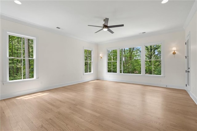 384 Hickory Pass, Alpharetta, GA 30004 - spare room featuring healthy amount of natural light, ornamental molding, a ceiling fan, wood finished floors, and baseboards