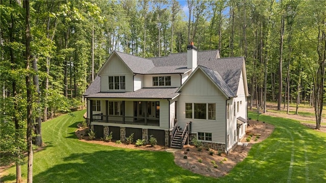 384 Hickory Pass, Alpharetta, GA 30004 - back of property featuring stairway, a shingled roof, and a lawn