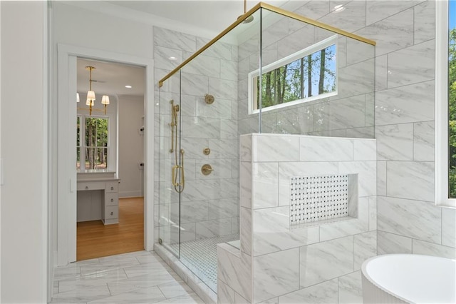 384 Hickory Pass, Alpharetta, GA 30004 - bathroom with a freestanding tub, marble finish flooring, a stall shower, and a chandelier