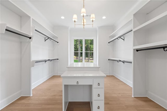 384 Hickory Pass, Alpharetta, GA 30004 - walk in closet with a chandelier and light wood-style floors