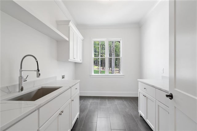 384 Hickory Pass, Alpharetta, GA 30004 - washroom with cabinet space, baseboards, washer hookup, ornamental molding, and dark tile patterned floors