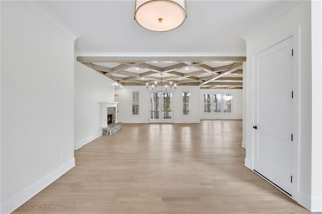 384 Hickory Pass, Alpharetta, GA 30004 - unfurnished living room with coffered ceiling, light wood finished floors, a chandelier, baseboards, and beam ceiling