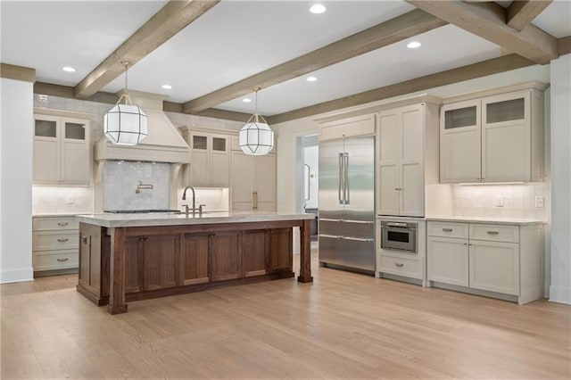 384 Hickory Pass, Alpharetta, GA 30004 - kitchen with stainless steel appliances, light wood finished floors, tasteful backsplash, light countertops, and beam ceiling