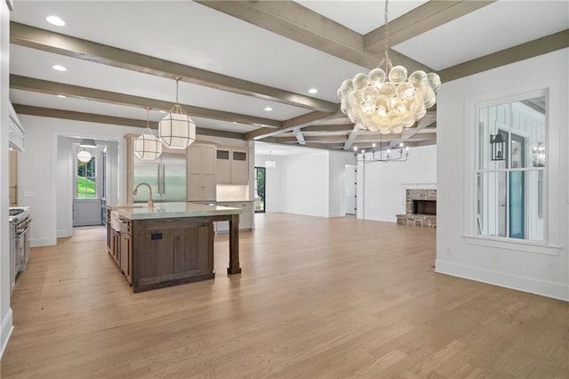 384 Hickory Pass, Alpharetta, GA 30004 - kitchen with baseboards, a chandelier, light wood-type flooring, beam ceiling, and recessed lighting