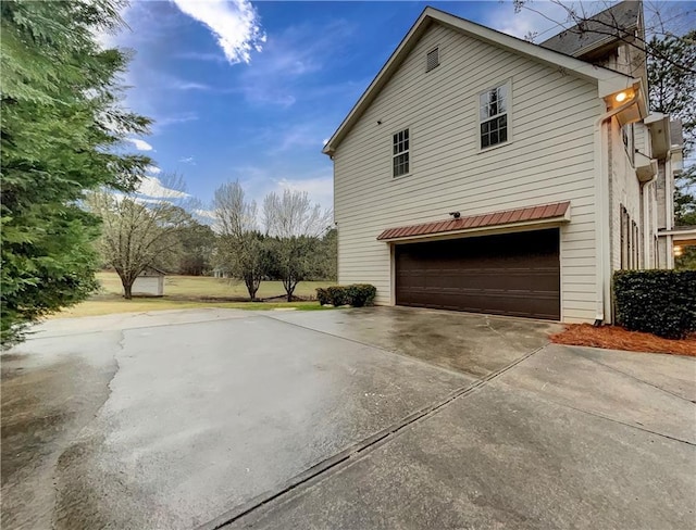 view of side of property with a garage