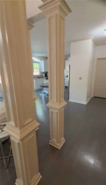 hall featuring ornate columns