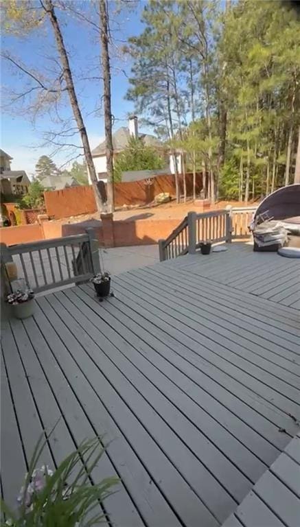 wooden deck with a jacuzzi