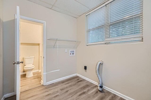 laundry area featuring hookup for a washing machine, electric dryer hookup, and wood-type flooring