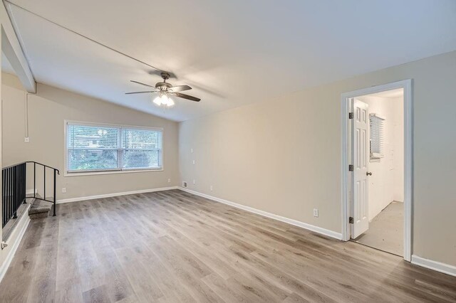 unfurnished living room featuring lofted ceiling, wood-type flooring, and ceiling fan