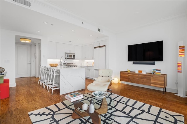 3630 Peachtree Rd NE Unit 2309, Atlanta, GA 30326 - living room with light wood-style flooring, recessed lighting, and crown molding