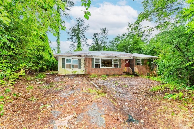 view of front of home with brick siding