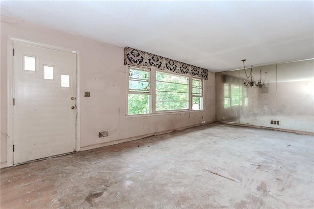 foyer entrance featuring concrete floors