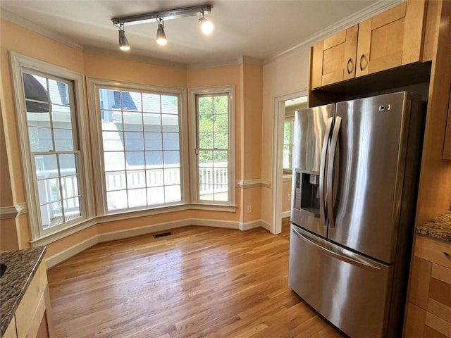 4770 Powers Park Ct NE, Marietta, GA 30067 - kitchen featuring stainless steel fridge with ice dispenser, baseboards, light wood-style floors, ornamental molding, and dark stone countertops