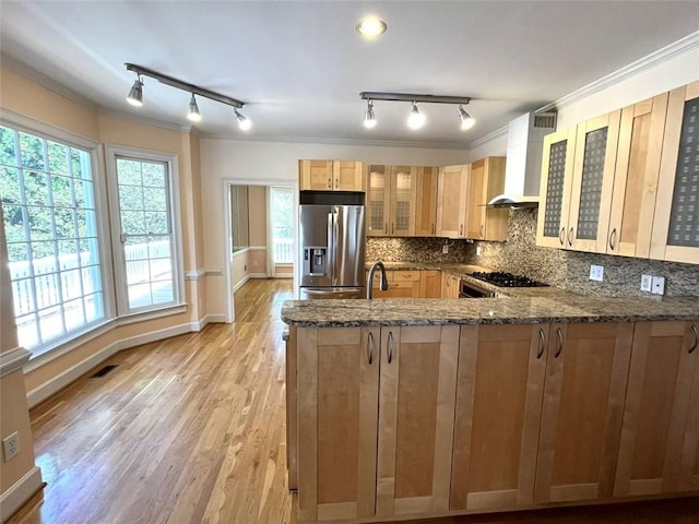 4770 Powers Park Ct NE, Marietta, GA 30067 - kitchen featuring stainless steel fridge with ice dispenser, wall chimney range hood, track lighting, dark stone counters, and a peninsula