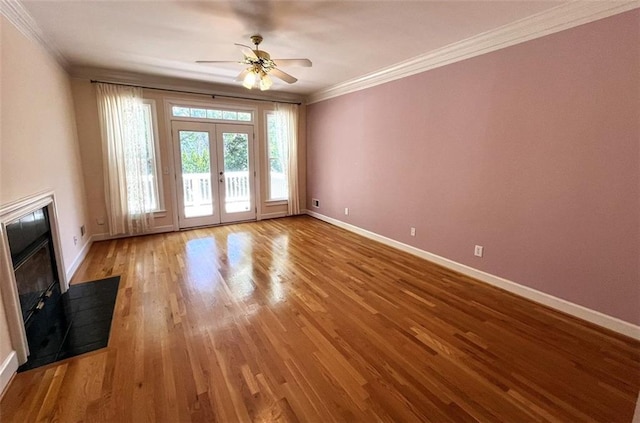 4770 Powers Park Ct NE, Marietta, GA 30067 - unfurnished living room with a fireplace, baseboards, crown molding, ceiling fan, and wood finished floors