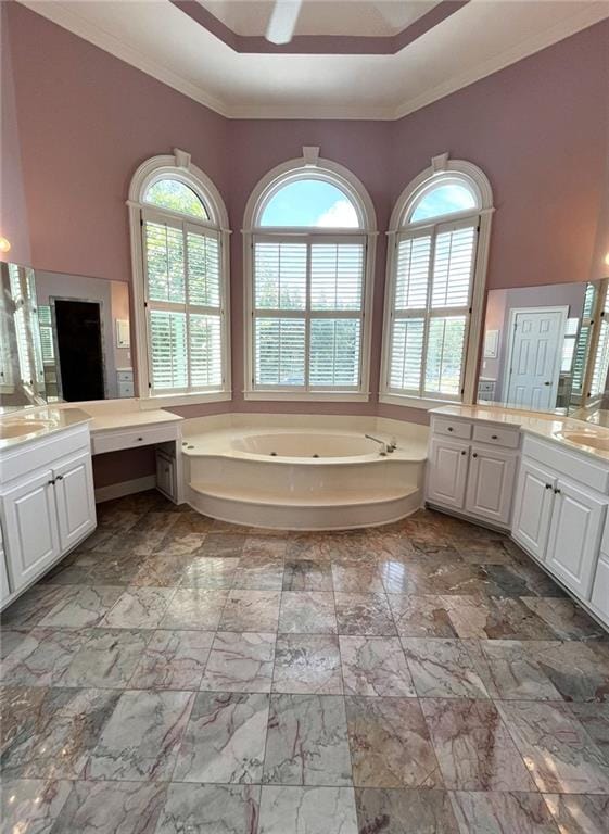 4770 Powers Park Ct NE, Marietta, GA 30067 - full bath with healthy amount of natural light, a jetted tub, ornamental molding, two vanities, and a raised ceiling