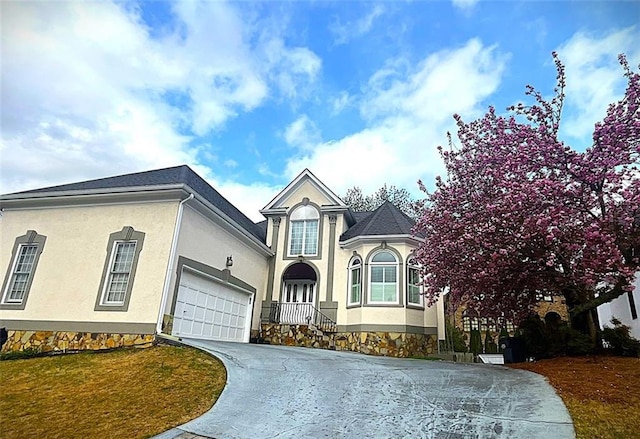 4770 Powers Park Ct NE, Marietta, GA 30067 - view of front of house featuring stucco siding, concrete driveway, and a garage