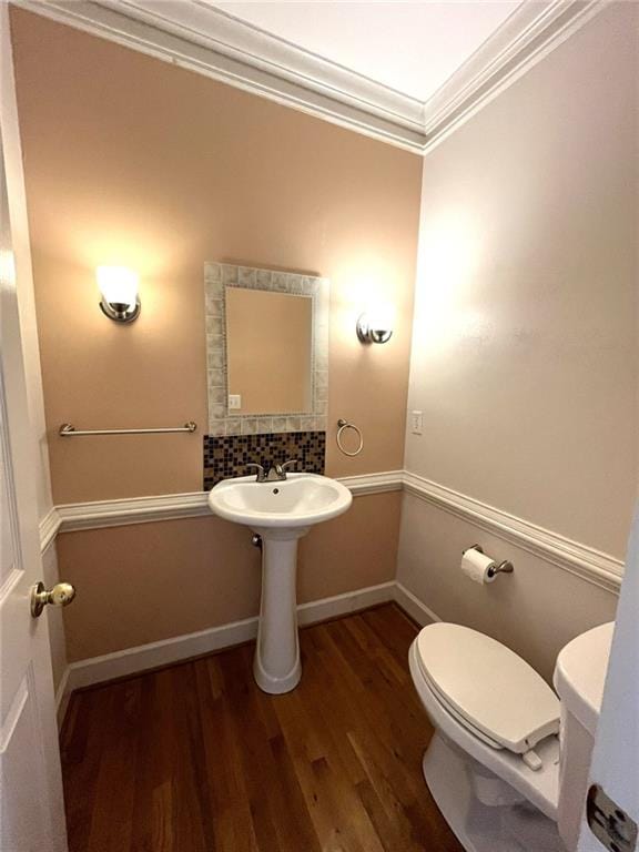 4770 Powers Park Ct NE, Marietta, GA 30067 - half bathroom featuring toilet, wood finished floors, and crown molding