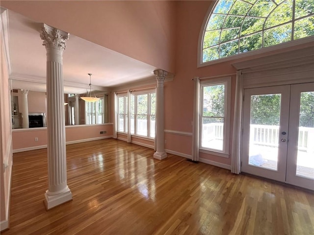 4770 Powers Park Ct NE, Marietta, GA 30067 - unfurnished living room featuring ornate columns, french doors, and wood finished floors