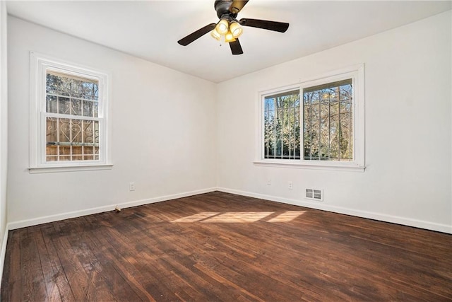 empty room with ceiling fan and hardwood / wood-style flooring