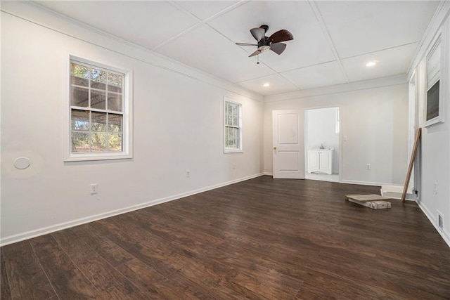 unfurnished room with dark wood-type flooring, ceiling fan, and coffered ceiling