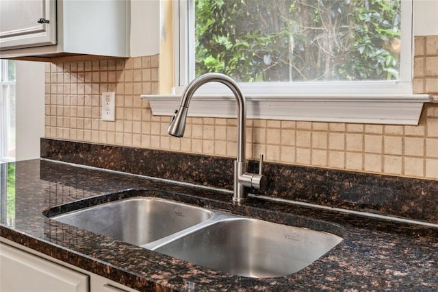 4515 Ambassador Way, Cumming, GA 30040 - kitchen view of a sink, tasteful backsplash, dark stone counters, and white cabinets