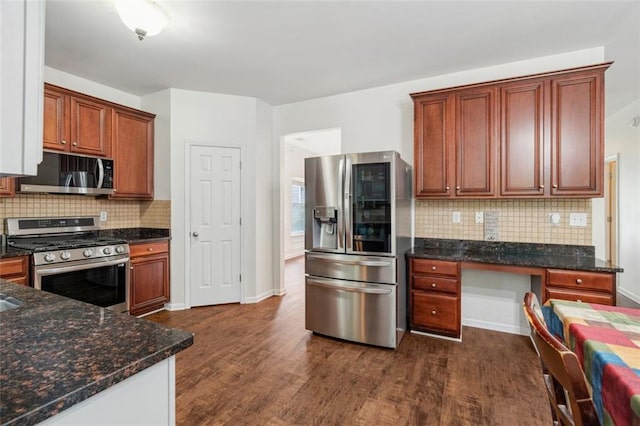 4515 Ambassador Way, Cumming, GA 30040 - kitchen with stainless steel appliances, dark wood-type flooring, decorative backsplash, dark stone countertops, and baseboards