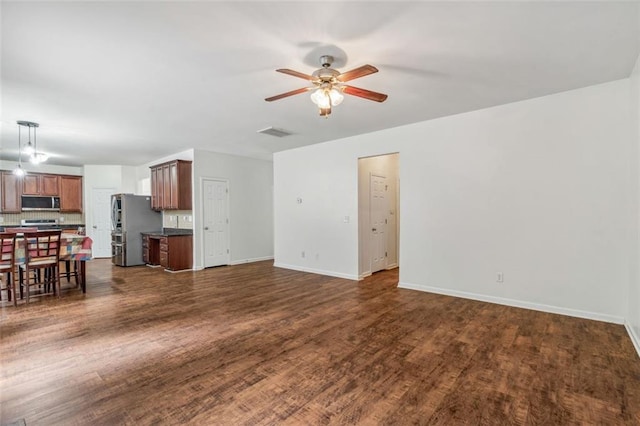 4515 Ambassador Way, Cumming, GA 30040 - unfurnished living room with a ceiling fan, dark wood-type flooring, and baseboards