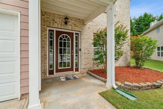 4515 Ambassador Way, Cumming, GA 30040 - view of exterior entry featuring brick siding, a porch, and a garage