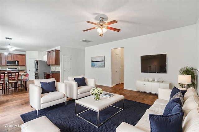 4515 Ambassador Way, Cumming, GA 30040 - living area with a ceiling fan, wood finished floors, and baseboards