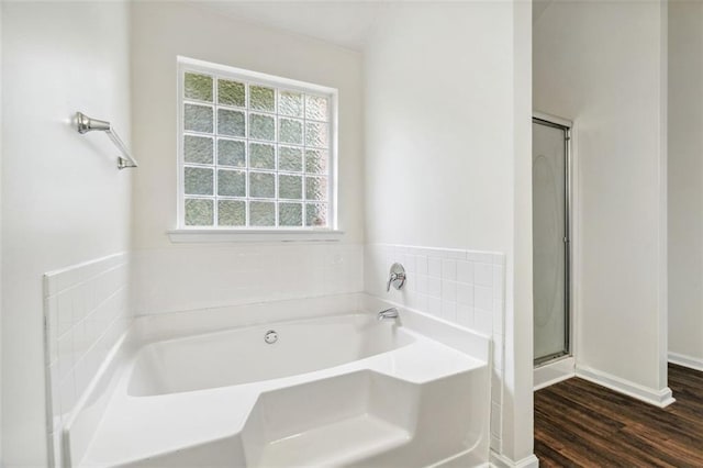 4515 Ambassador Way, Cumming, GA 30040 - bathroom with plenty of natural light, a bath, wood finished floors, and a shower stall